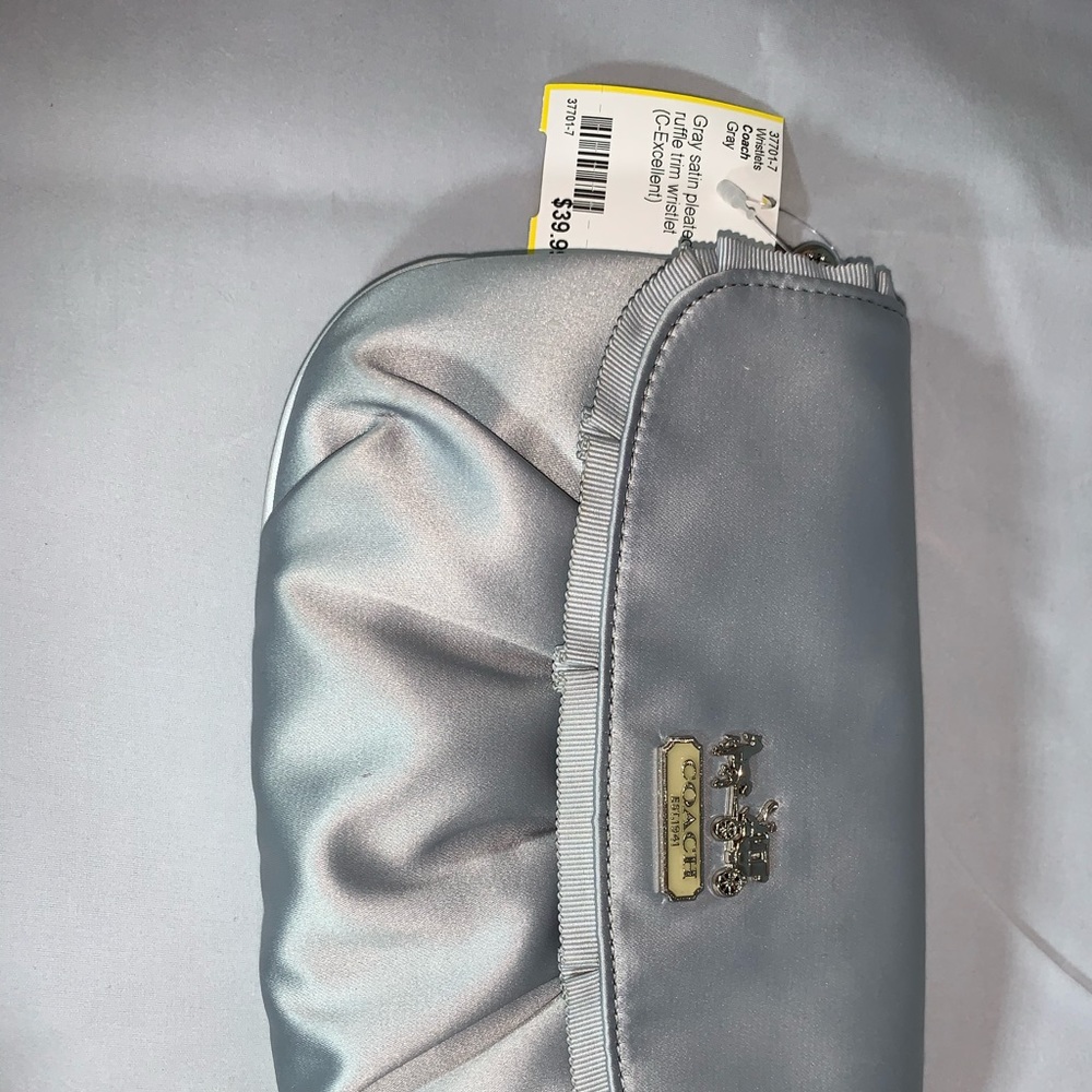 Silver polyester wrislet .silver zipper